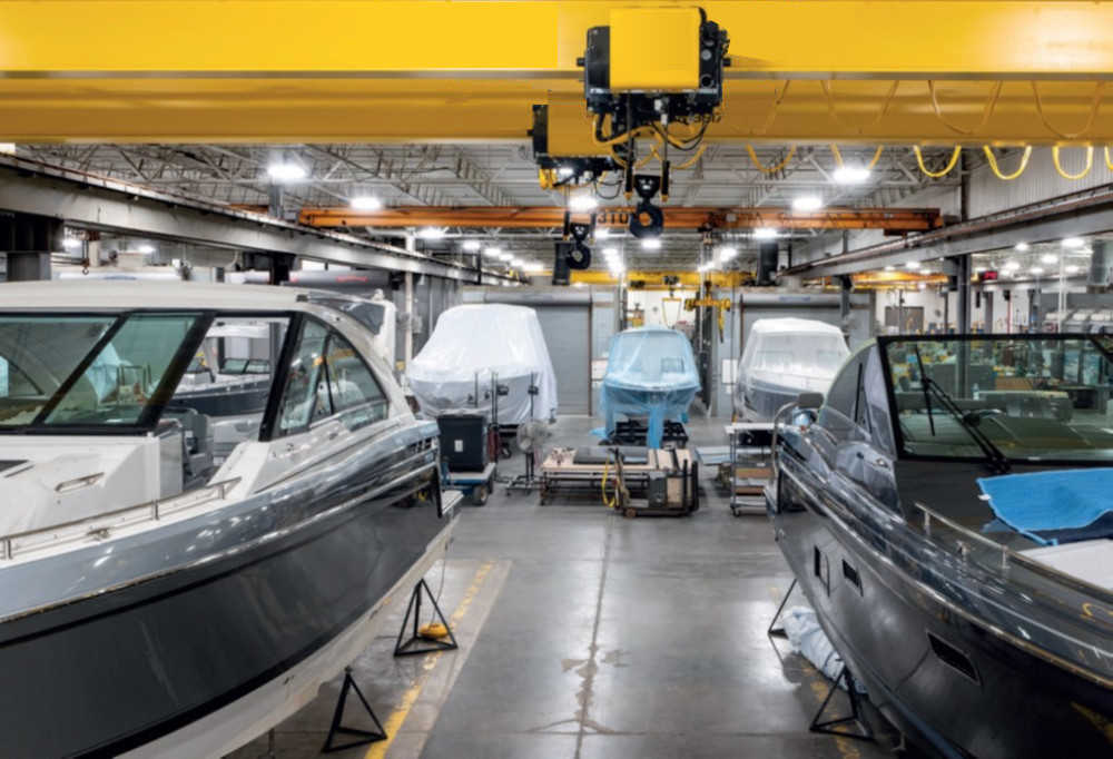 Bridge crane at work in shipbuilding plant