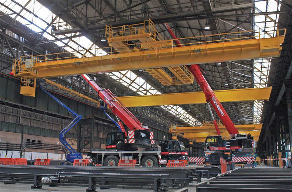 The steel distribution center uses four bridge cranes